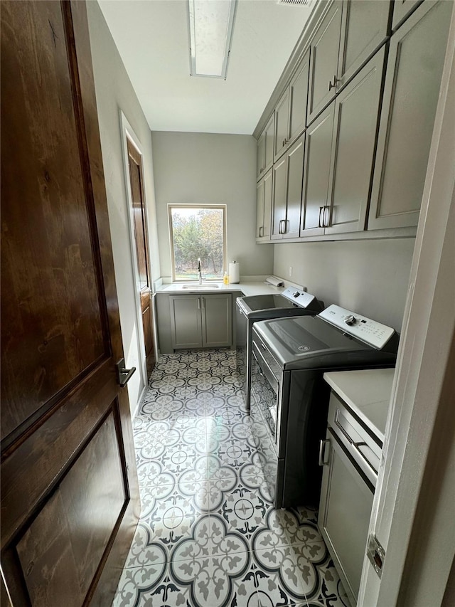 474 Eagle Cove Cir, Tioga, TX 76271 - laundry room featuring cabinet space and washer and clothes dryer