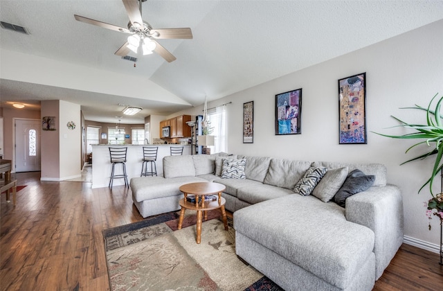 1312 Dakota Trl, Krum, TX 76249 - living room featuring ceiling fan, wood finished floors, baseboards, and lofted ceiling