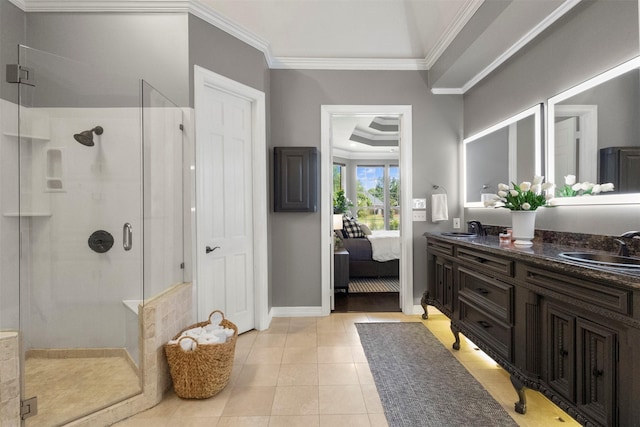 2906 Cottonwood Ln, Colleyville, TX 76034 - ensuite bathroom with a shower stall, crown molding, double vanity, tile patterned floors, and baseboards