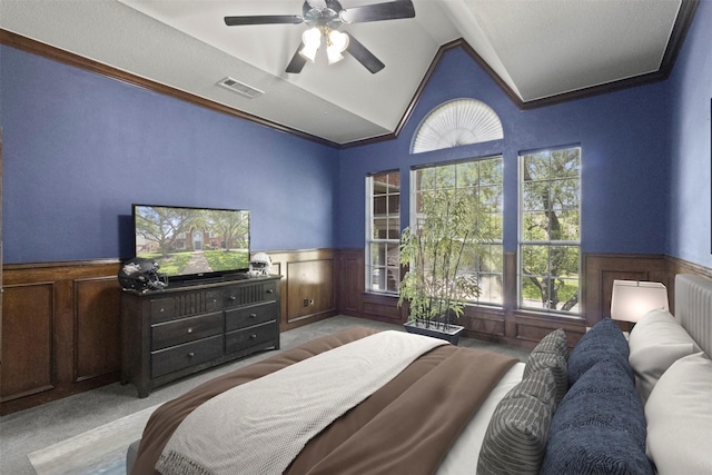 2906 Cottonwood Ln, Colleyville, TX 76034 - bedroom featuring a wainscoted wall, light carpet, lofted ceiling, a ceiling fan, and ornamental molding