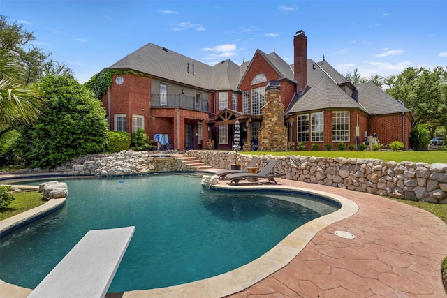 2906 Cottonwood Ln, Colleyville, TX 76034 - outdoor pool with a diving board and a patio area