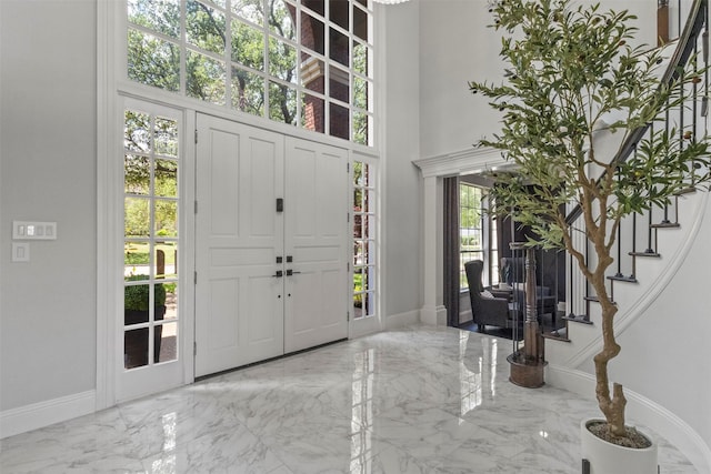 2906 Cottonwood Ln, Colleyville, TX 76034 - entrance foyer with marble tiled floors, stairs, baseboards, and a high ceiling
