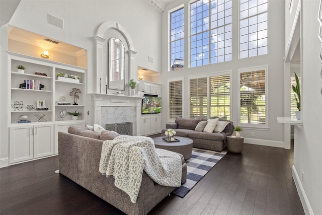 2906 Cottonwood Ln, Colleyville, TX 76034 - living room featuring dark wood-type flooring, a high end fireplace, baseboards, and a towering ceiling