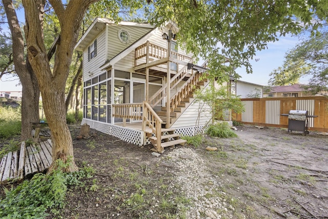53 Bentwood Dr, Pottsboro, TX 75076 - rear view of house with a sunroom, stairway, and a wooden deck