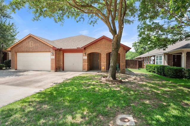 2411 Ravenwood Ct, Mansfield, TX 76063 - view of front of home featuring brick siding, an attached garage, concrete driveway, and a shingled roof