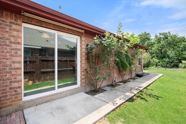 2411 Ravenwood Ct, Mansfield, TX 76063 - view of side of home with brick siding and a patio