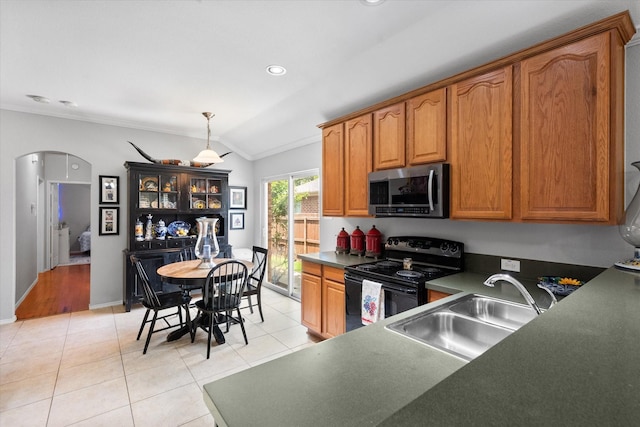 2411 Ravenwood Ct, Mansfield, TX 76063 - kitchen featuring stainless steel microwave, black electric range, vaulted ceiling, arched walkways, and dark countertops