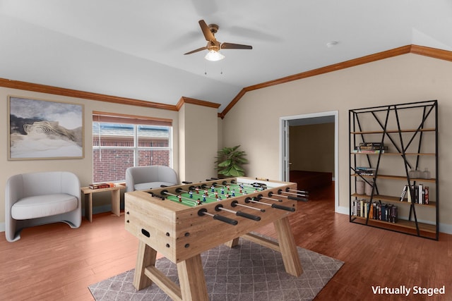 9772 Hickory St, Frisco, TX 75035 - game room with ornamental molding, lofted ceiling, ceiling fan, wood finished floors, and baseboards
