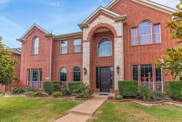9772 Hickory St, Frisco, TX 75035 - view of front of house with brick siding and a front lawn