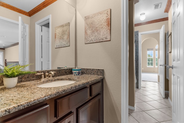 9772 Hickory St, Frisco, TX 75035 - bathroom with tile patterned floors, crown molding, vanity, and baseboards