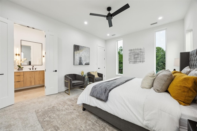 5217 Lindsley Ave, Dallas, TX 75223 - bedroom with recessed lighting, a sink, light colored carpet, ensuite bath, and ceiling fan
