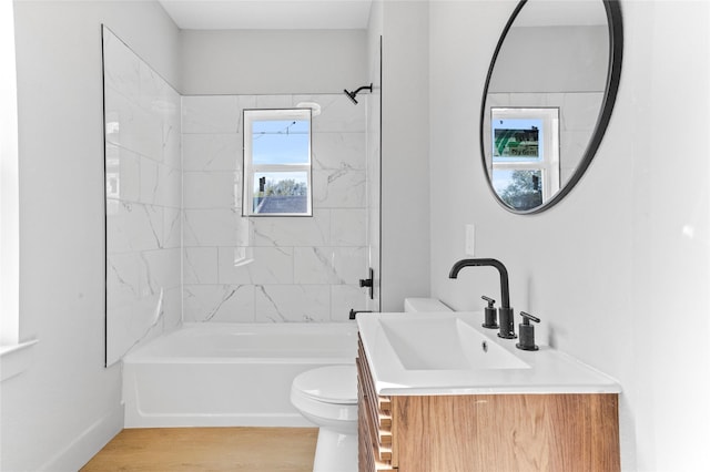 511 W Munson St, Denison, TX 75020 - full bathroom featuring toilet, shower / bath combination, wood finished floors, and vanity