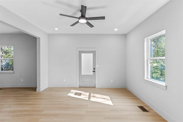 511 W Munson St, Denison, TX 75020 - spare room featuring plenty of natural light, ceiling fan, recessed lighting, baseboards, and light wood-type flooring
