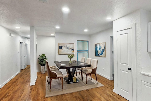 3920 Vanette Ln, Dallas, TX 75216 - dining area featuring light wood finished floors, baseboards, and recessed lighting