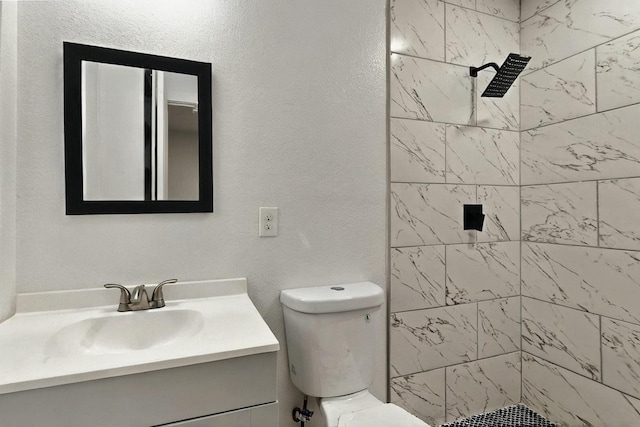 3920 Vanette Ln, Dallas, TX 75216 - full bath with vanity, tiled shower, and toilet