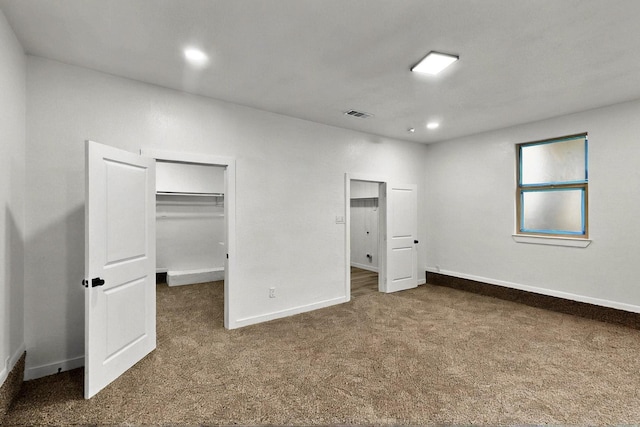 3920 Vanette Ln, Dallas, TX 75216 - unfurnished bedroom featuring dark colored carpet, a spacious closet, baseboards, and a closet