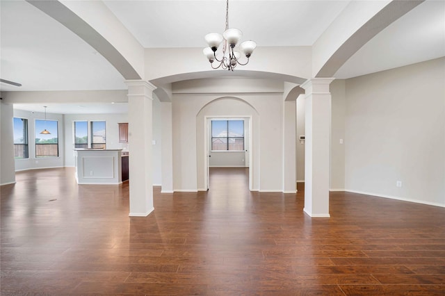 5125 Sugarberry Dr, Mckinney, TX 75071 - entryway featuring dark wood-style flooring, arched walkways, healthy amount of natural light, and baseboards