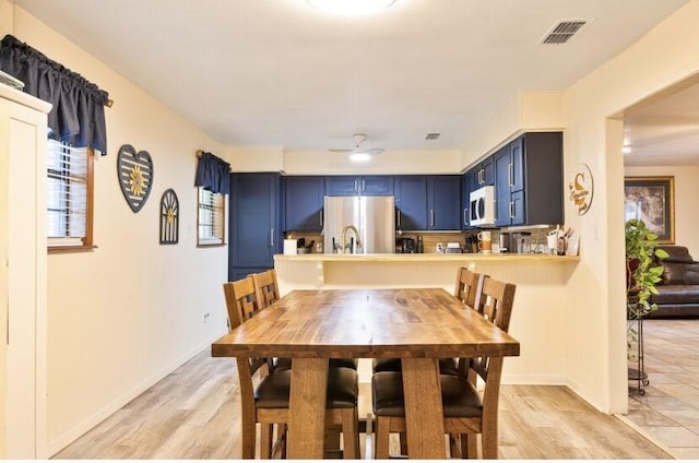 324 Peachtree St, Fairfield, TX 75840 - dining space with a ceiling fan, light wood finished floors, healthy amount of natural light, and baseboards