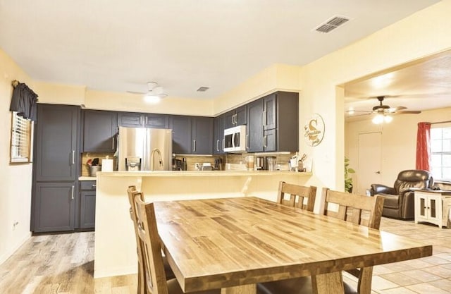324 Peachtree St, Fairfield, TX 75840 - dining area featuring ceiling fan, light wood finished floors, and baseboards