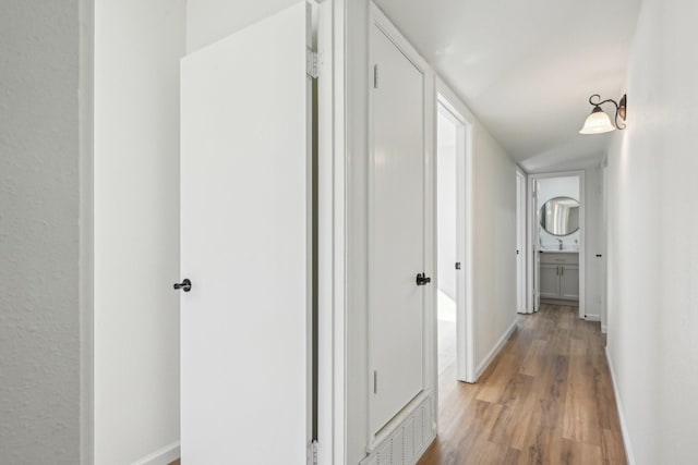 1400 N Floyd Rd, Richardson, TX 75080 - corridor featuring light wood finished floors and baseboards