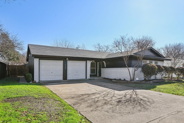 1400 N Floyd Rd, Richardson, TX 75080 - ranch-style home with an attached garage, brick siding, and driveway