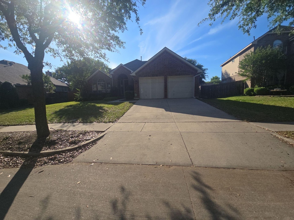 4832 Belladonna Dr, Fort Worth, TX 76123 - view of front of home featuring concrete driveway and an attached garage