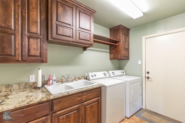 5626 Meadow Dr, Abilene, TX 79606 - washroom with cabinet space and washing machine and clothes dryer