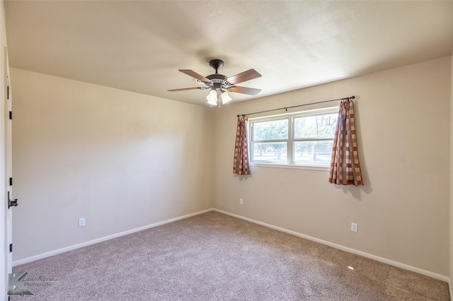 5626 Meadow Dr, Abilene, TX 79606 - spare room featuring carpet flooring, a ceiling fan, and baseboards