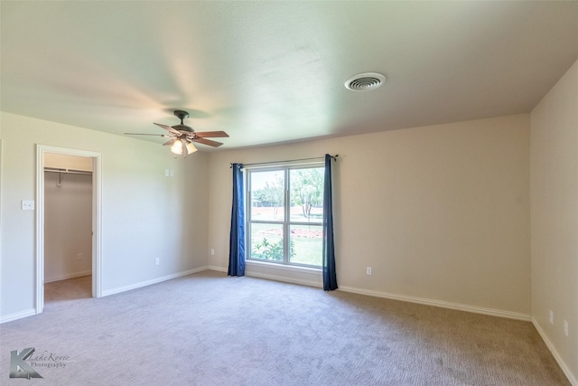 5626 Meadow Dr, Abilene, TX 79606 - unfurnished bedroom with carpet flooring, a spacious closet, baseboards, and a ceiling fan
