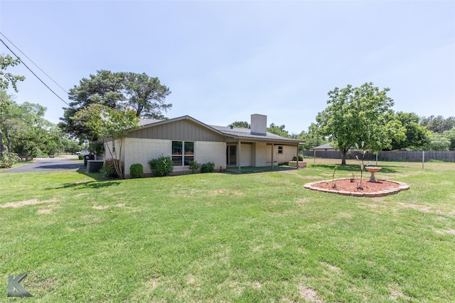 5626 Meadow Dr, Abilene, TX 79606 - rear view of property with brick siding and a chimney