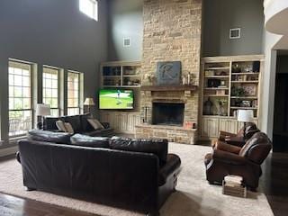 470 Granite Way, Jacksboro, TX 76458 - living room featuring a fireplace, a high ceiling, and wood finished floors