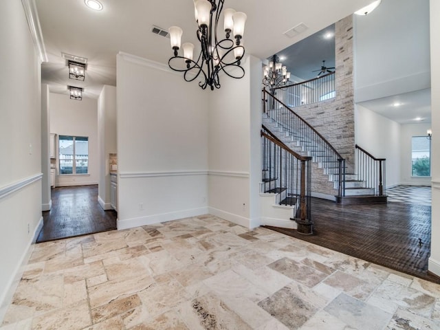 4604 Donna Ln, Parker, TX 75002 - unfurnished dining area with a high ceiling, stone tile flooring, stairway, baseboards, and a chandelier