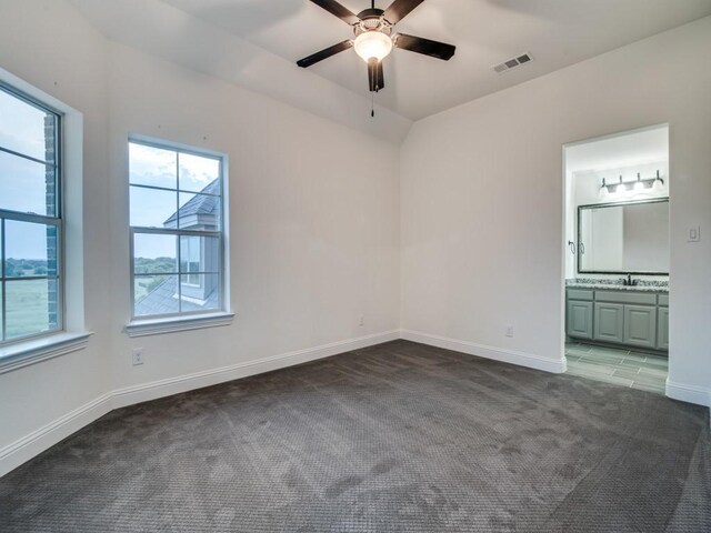 4604 Donna Ln, Parker, TX 75002 - unfurnished bedroom with carpet floors, baseboards, a sink, connected bathroom, and a ceiling fan
