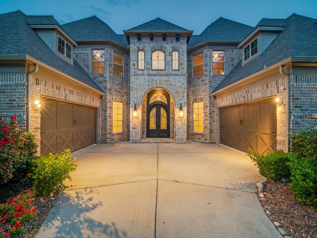 4604 Donna Ln, Parker, TX 75002 - french provincial home featuring brick siding, driveway, french doors, and an attached garage