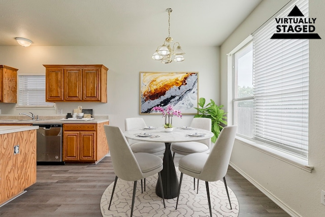 1720 Triumph Trl, Arlington, TX 76002 - dining room with light wood-style flooring, a chandelier, and baseboards
