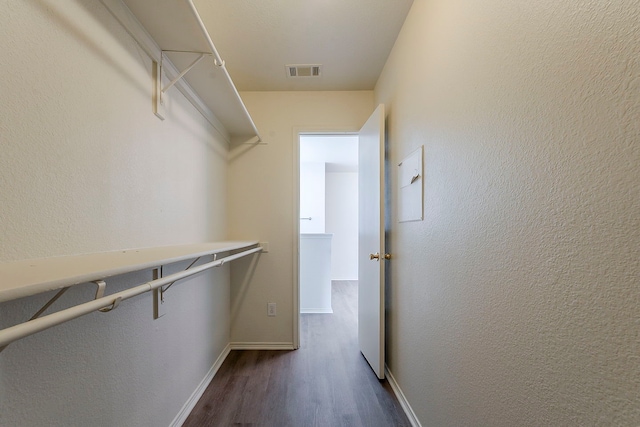 1720 Triumph Trl, Arlington, TX 76002 - spacious closet with dark wood-style flooring