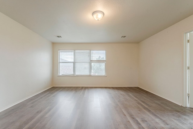 1720 Triumph Trl, Arlington, TX 76002 - empty room featuring wood finished floors and baseboards