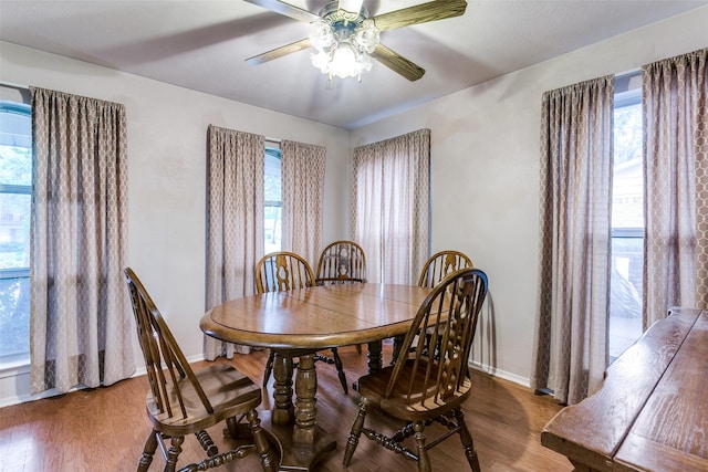 2412 Crestview Cir, Irving, TX 75062 - dining room featuring baseboards, wood finished floors, plenty of natural light, and a ceiling fan