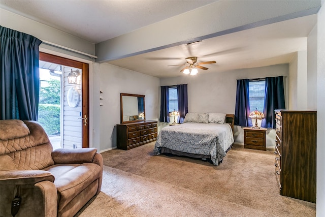 2412 Crestview Cir, Irving, TX 75062 - bedroom with access to outside, light colored carpet, baseboards, and a ceiling fan