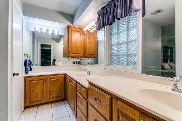 2412 Crestview Cir, Irving, TX 75062 - full bath with tile patterned flooring and double vanity