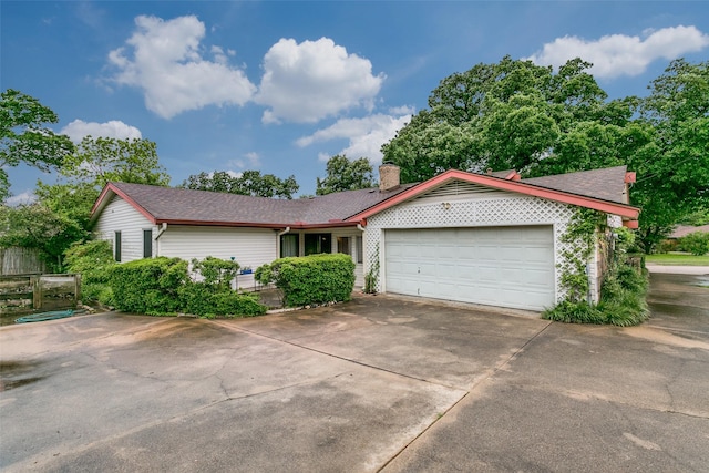 2412 Crestview Cir, Irving, TX 75062 - ranch-style house with an attached garage, concrete driveway, a chimney, and a shingled roof