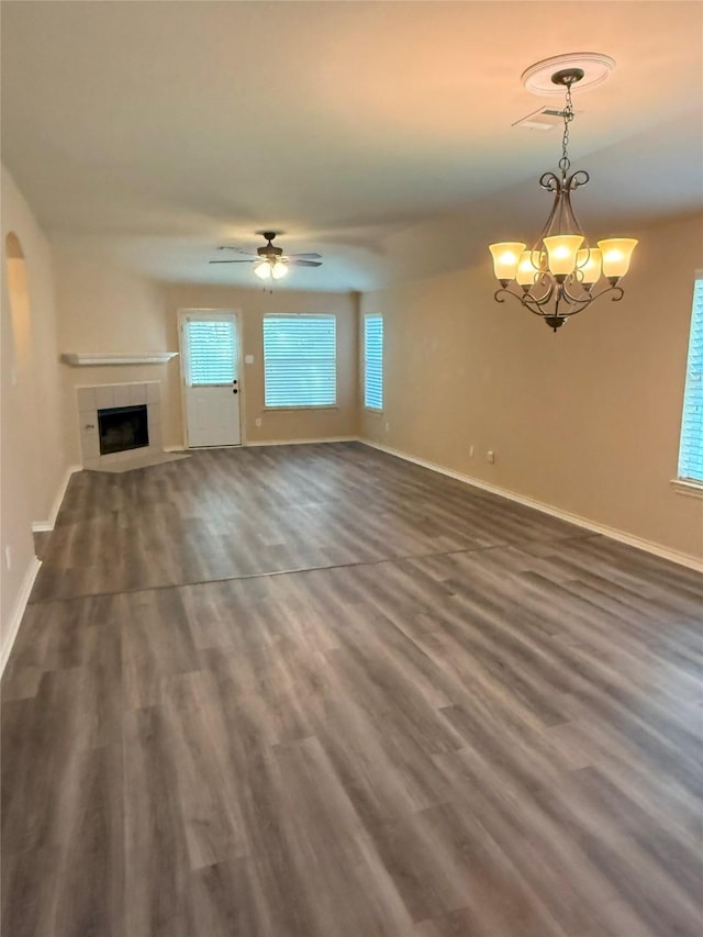 716 Riverhead Dr, Wylie, TX 75098 - unfurnished living room featuring a tile fireplace, baseboards, a chandelier, and dark wood-style floors
