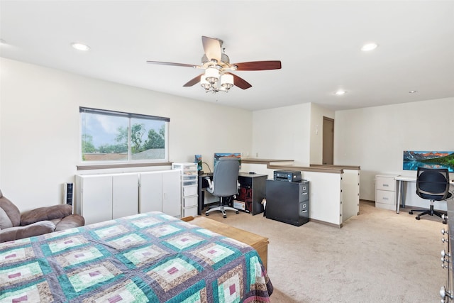 bedroom featuring an office area, light carpet, recessed lighting, and ceiling fan