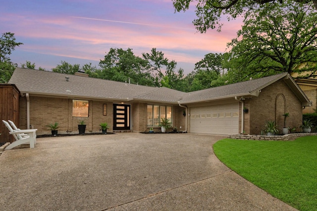 2003 Park Hill Dr, Arlington, TX 76012 - view of front of property with brick siding, concrete driveway, a garage, and roof with shingles