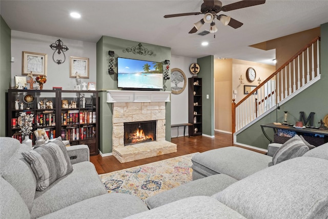1412 Millbrook Ln, Wylie, TX 75098 - living room with a ceiling fan, wood finished floors, stairs, a stone fireplace, and baseboards
