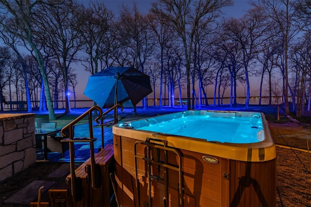 7327 Open Water Pt, Quinlan, TX 75474 - pool at dusk featuring a hot tub