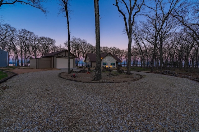 7327 Open Water Pt, Quinlan, TX 75474 - view of front facade featuring an outbuilding, a detached garage, and driveway
