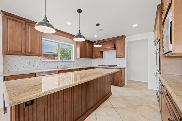 7205 Lake Roberts Way, Arlington, TX 76002 - kitchen featuring a sink, stainless steel appliances, tasteful backsplash, light stone counters, and hanging light fixtures