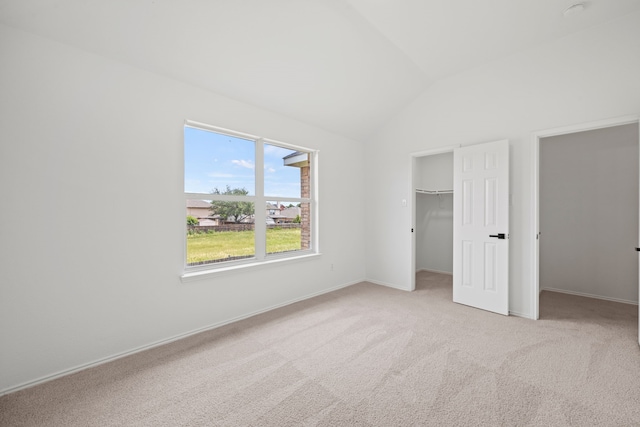 7205 Lake Roberts Way, Arlington, TX 76002 - unfurnished bedroom with vaulted ceiling, light carpet, a spacious closet, baseboards, and a closet