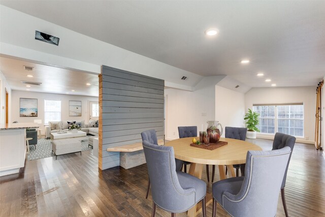 8919 San Fernando Way, Dallas, TX 75218 - dining room featuring dark wood-type flooring, lofted ceiling, and recessed lighting